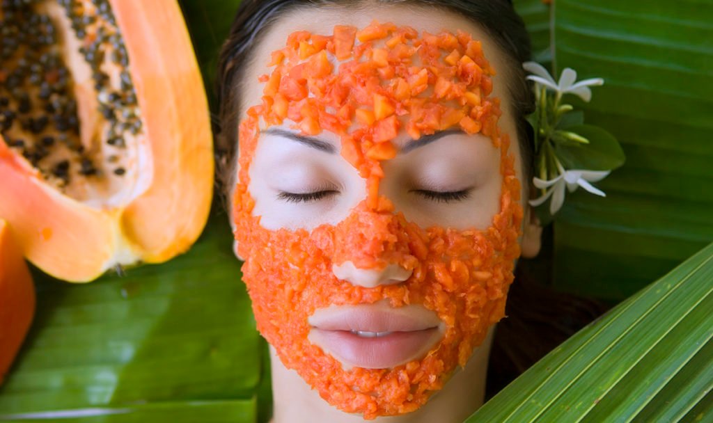 Beautiful woman having Fresh Papaya Facial Mask apply